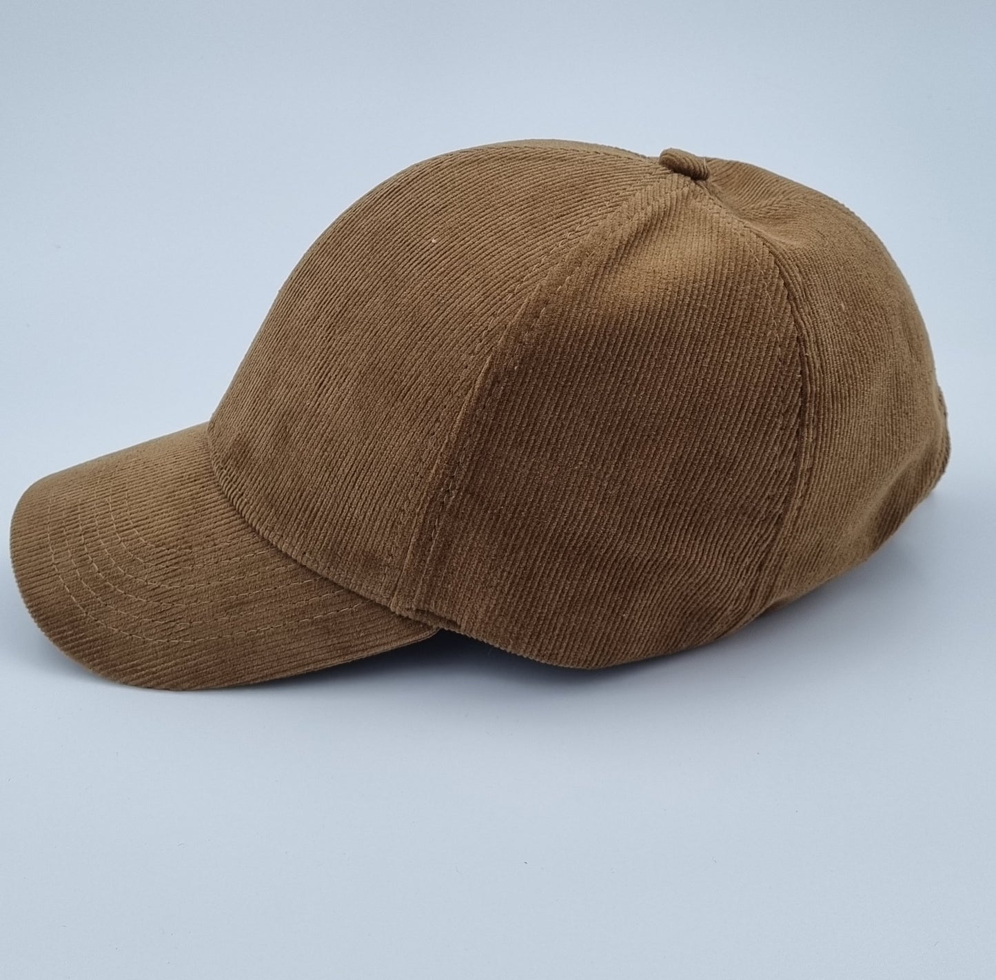 Coffee-colored corduroy baseball cap with silver mesh lining for EMF protection, featuring an adjustable metal buckle for a comfortable fit.